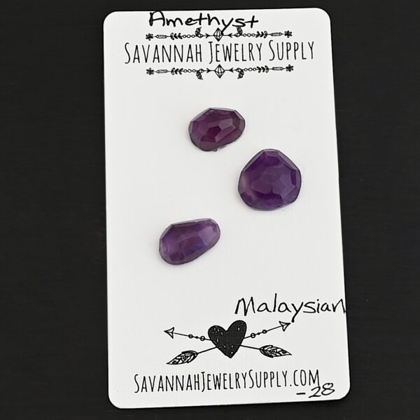 Malaysian Rose Cut Amethyst Cabochon Parcel shown on business card