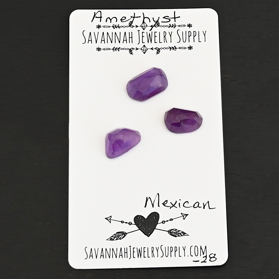 Mexican Rose Cut Amethyst Cabochon Parcel shown on business card
