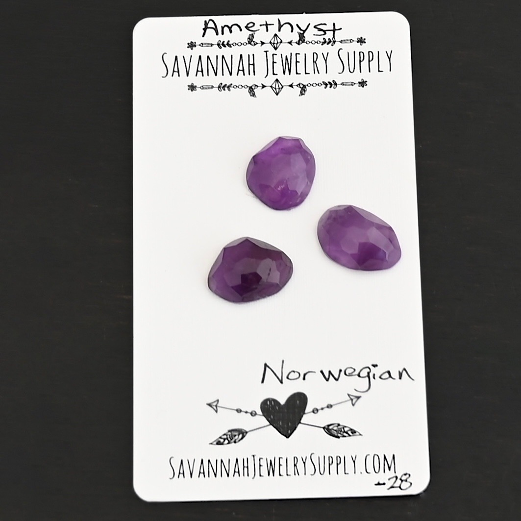 Norwegian Rose Cut Amethyst Cabochon Parcel shown on business card