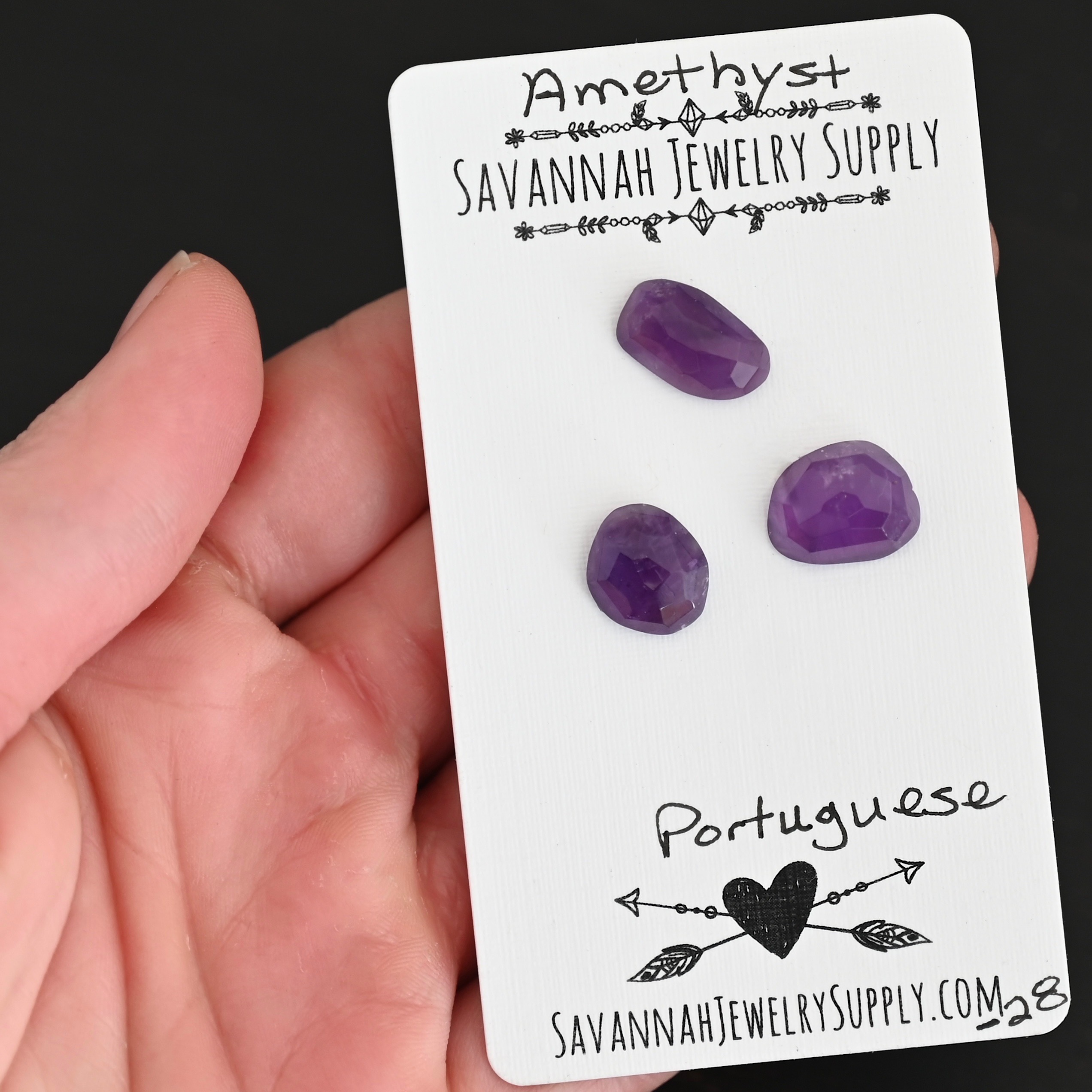 Portuguese Rose Cut Amethyst Cabochon Parcel shown in hand