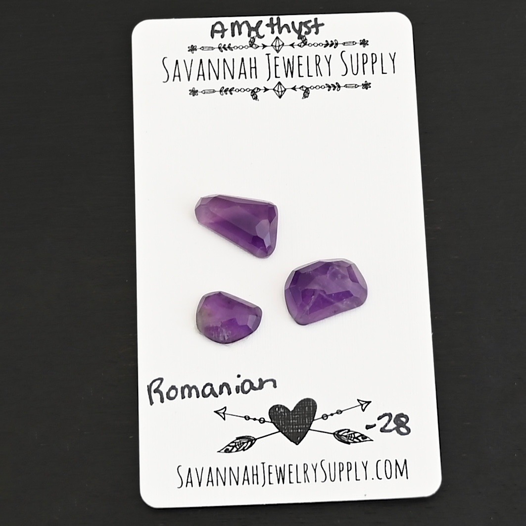 Romanian Rose Cut Amethyst Cabochon Parcel shown on business card