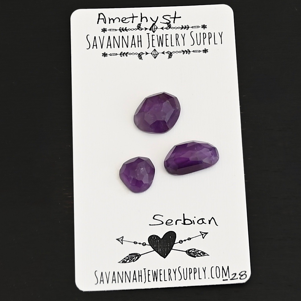 Serbian Rose Cut Amethyst Cabochon Parcel shown on business card