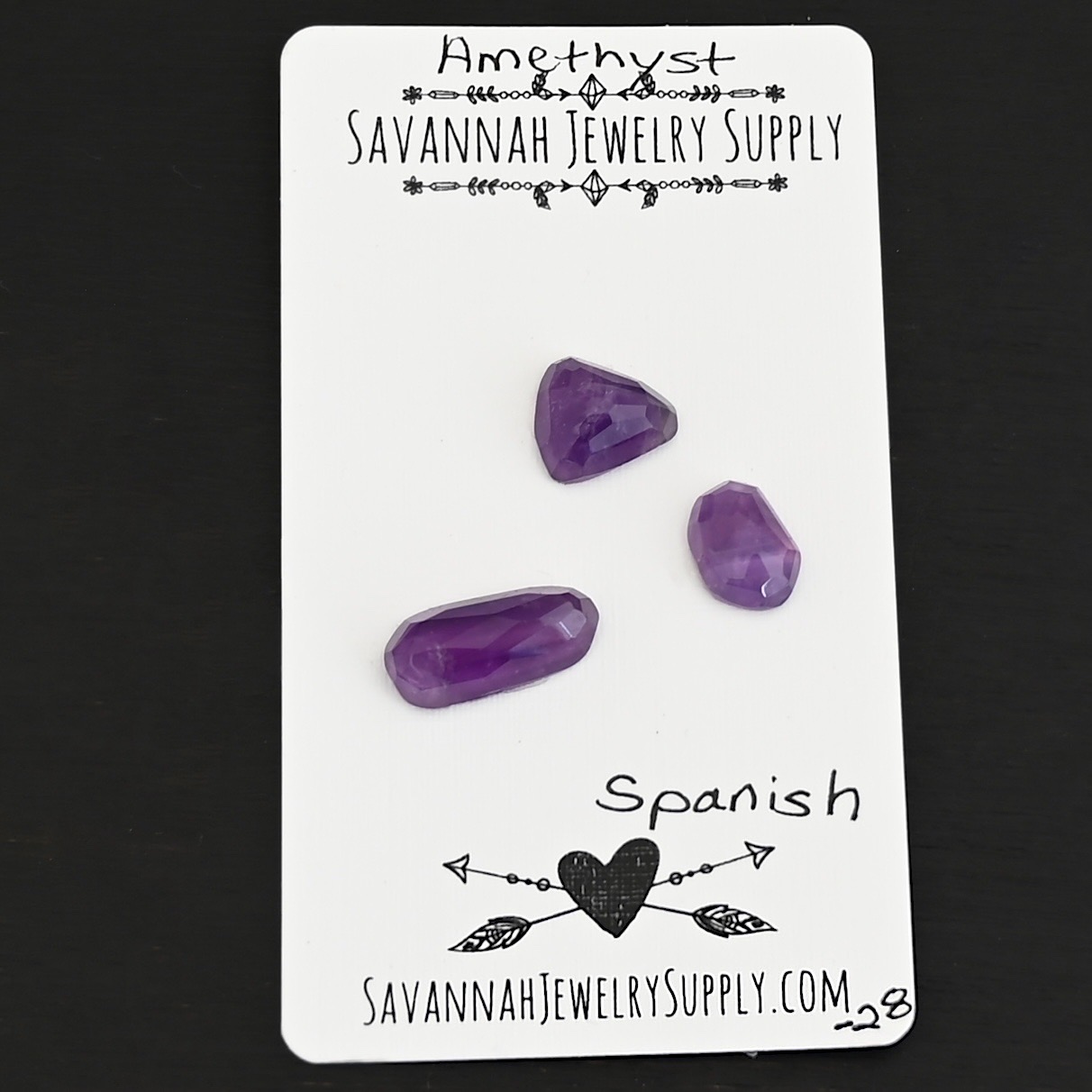 Spanish Rose Cut Amethyst Cabochon Parcel shown on business card