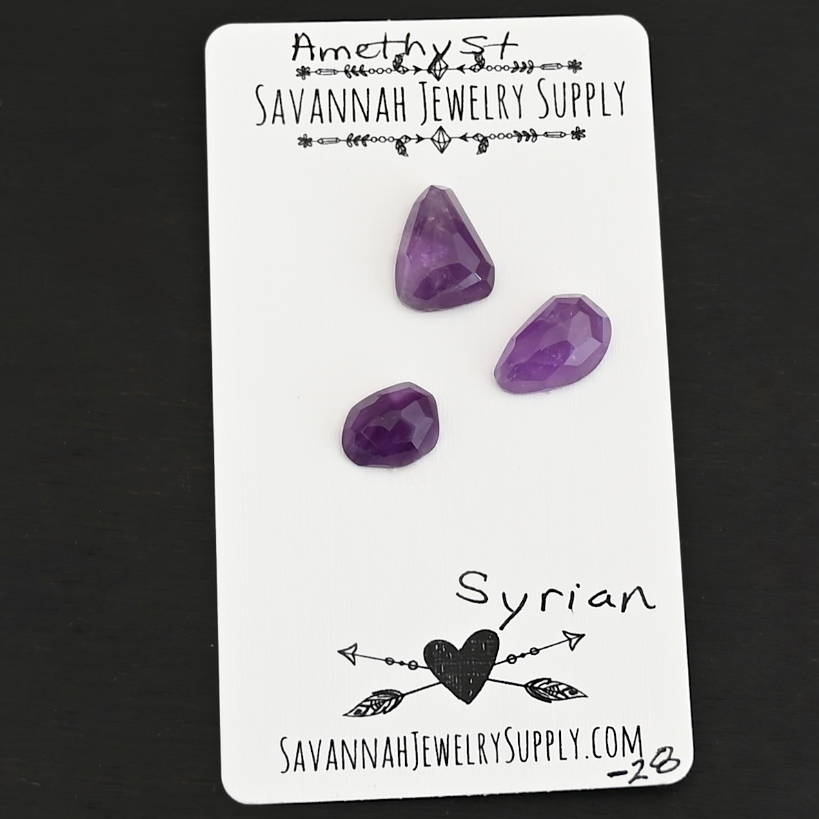 Syrian Rose Cut Amethyst Cabochon Parcel shown on business card