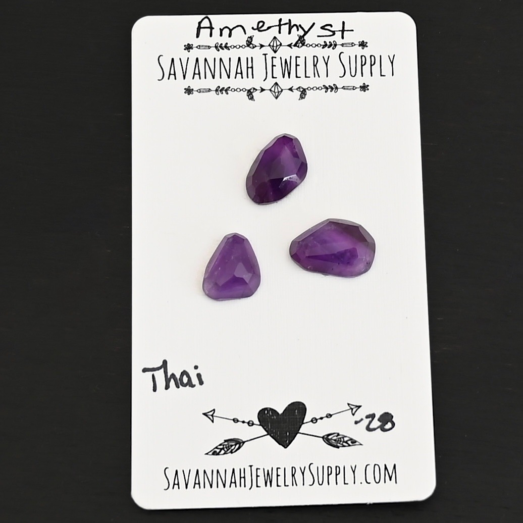 Thai Rose Cut Amethyst Cabochon Parcel shown on business card