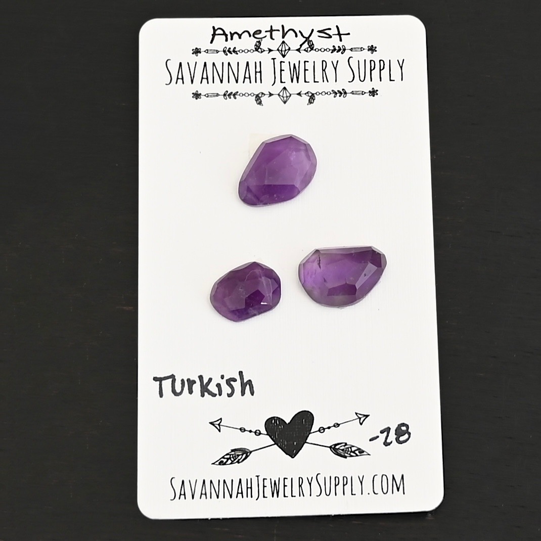 Turkish Rose Cut Amethyst Cabochon Parcel shown on business card