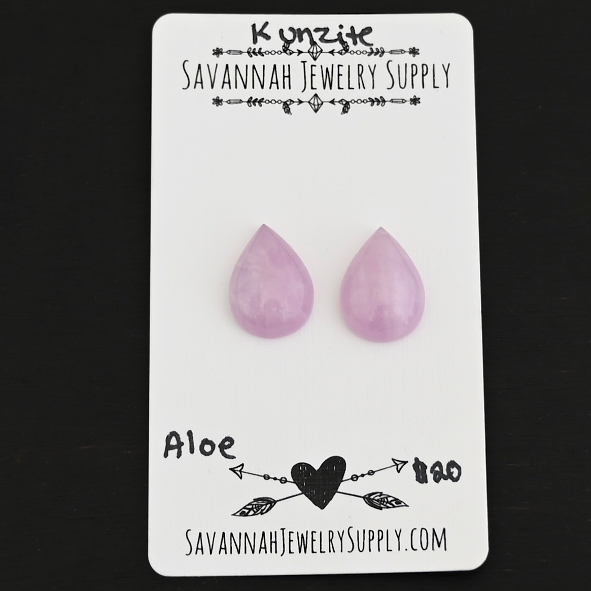 Aloe Kunzite Cabochon Parcel shown on business card