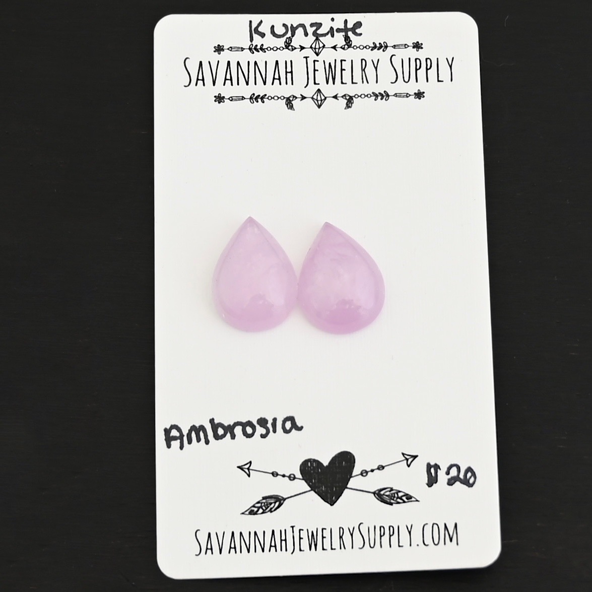 Ambrosia Kunzite Cabochon Parcel shown on business card