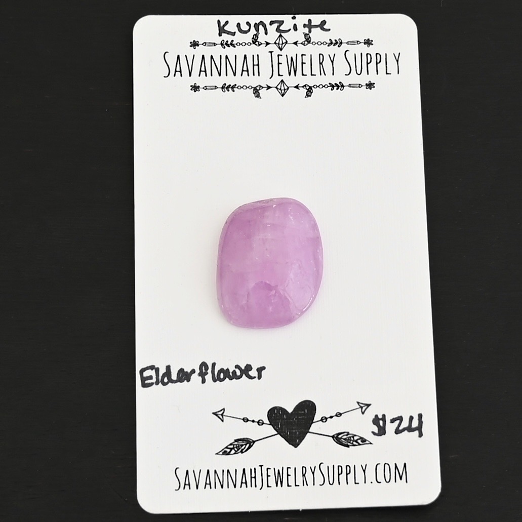 Elderflower Kunzite Cabochon Parcel shown on business card