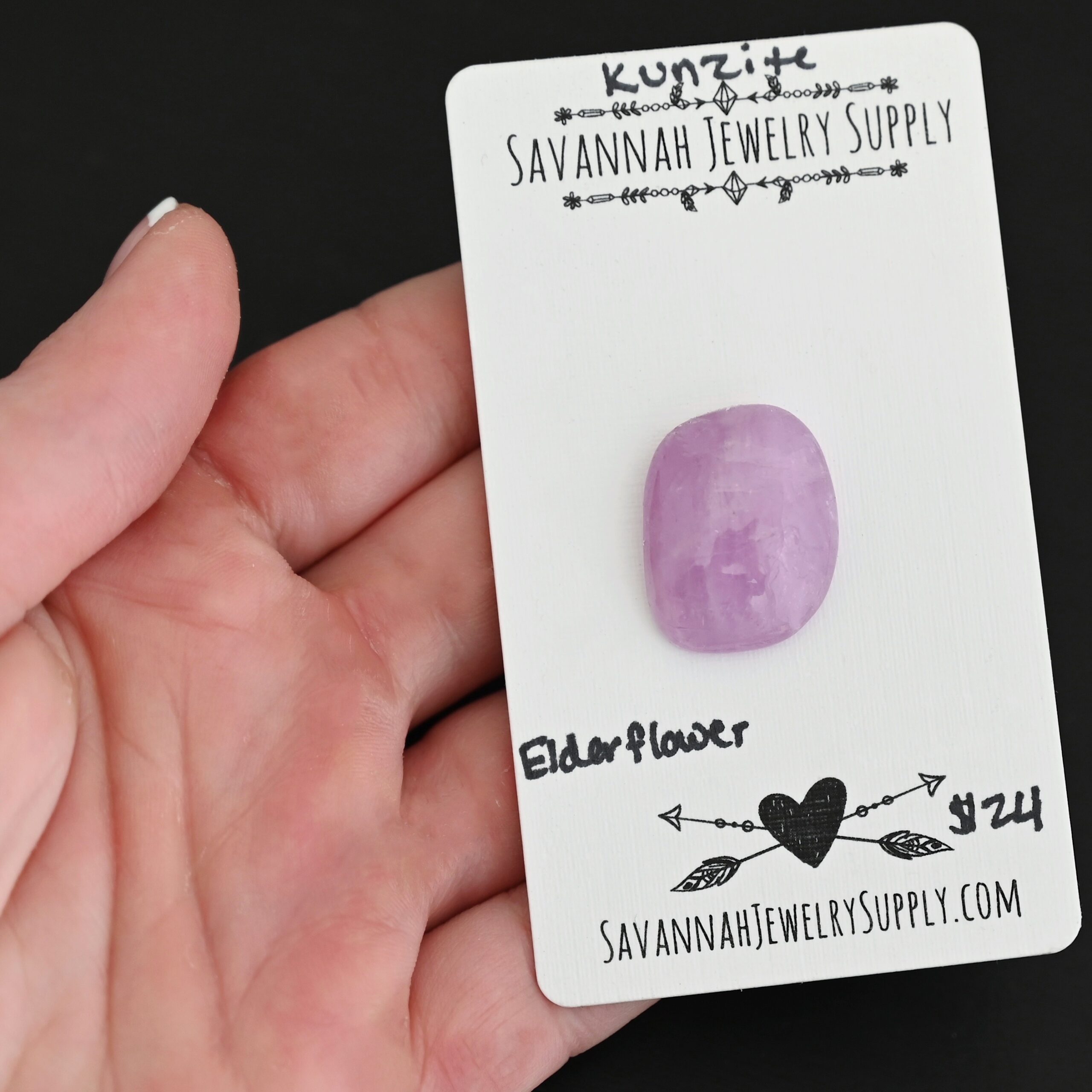 Elderflower Kunzite Cabochon Parcel shown in hand