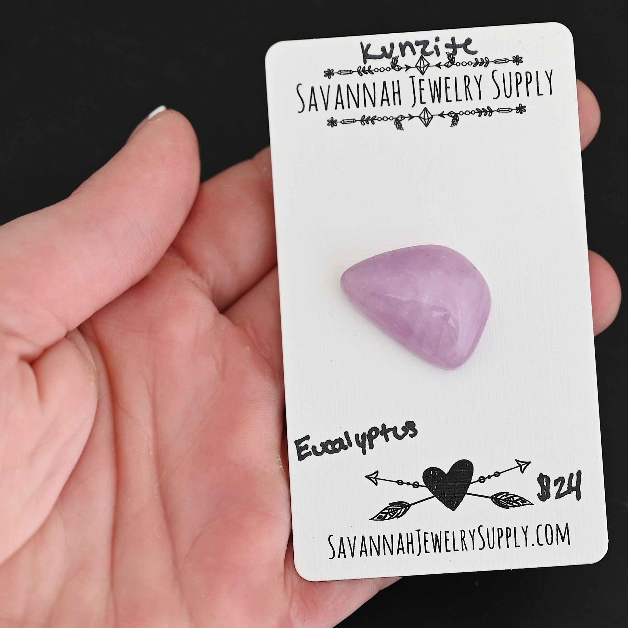 Eucalyptus Kunzite Cabochon Parcel shown in hand
