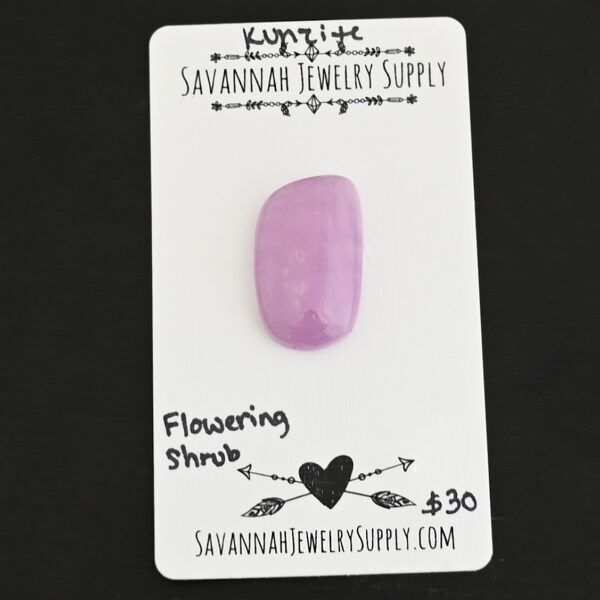 Flowering Shrub Kunzite Cabochon Parcel shown on business card