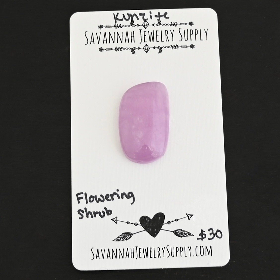 Flowering Shrub Kunzite Cabochon Parcel shown on business card