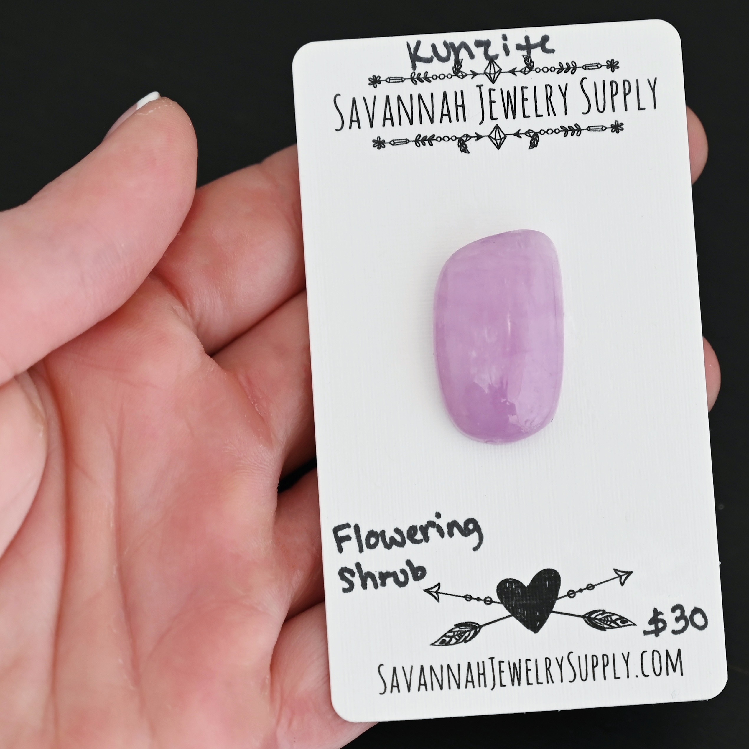 Flowering Shrub Kunzite Cabochon Parcel shown in hand