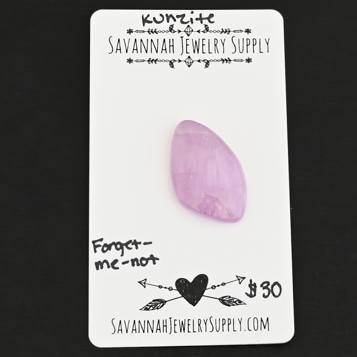 Forget-Me-Not Kunzite Cabochon Parcel shown on business card