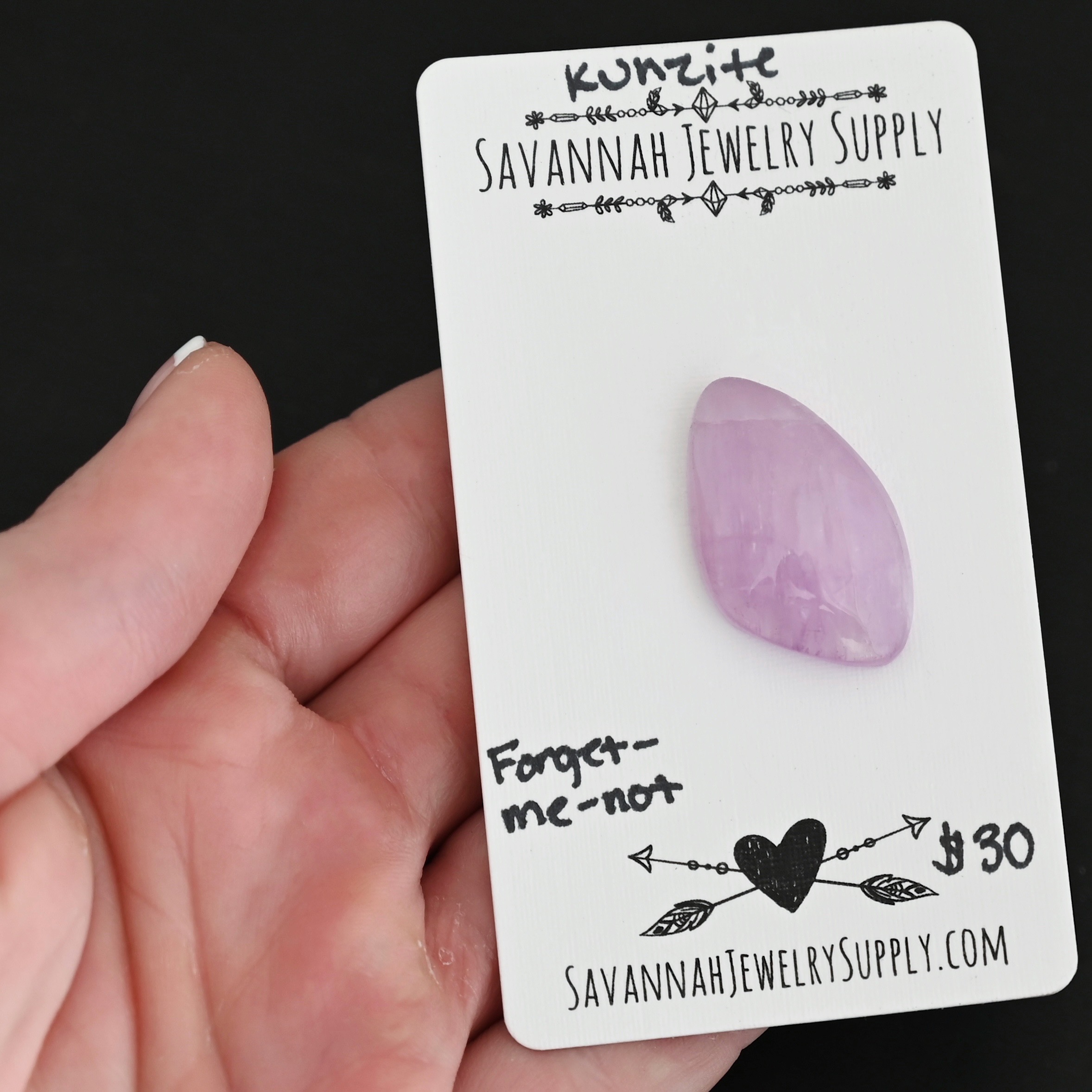 Forget-Me-Not Kunzite Cabochon Parcel shown in hand