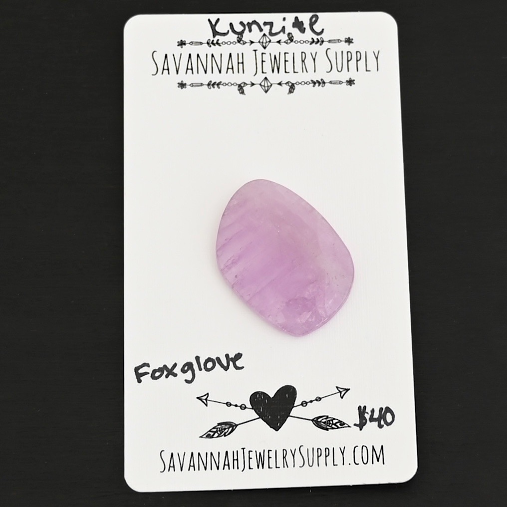 Foxglove Kunzite Cabochon Parcel shown on business card