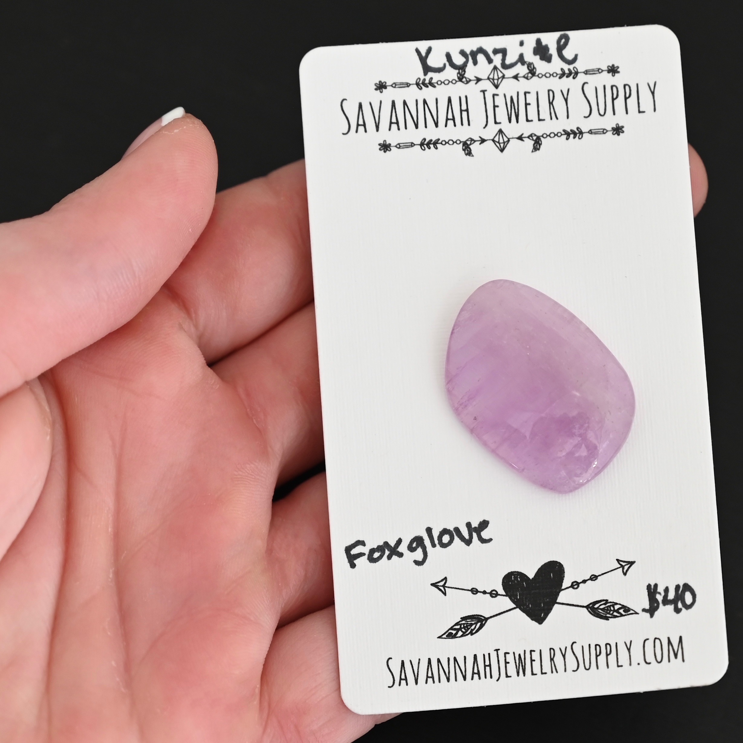 Foxglove Kunzite Cabochon Parcel shown in hand