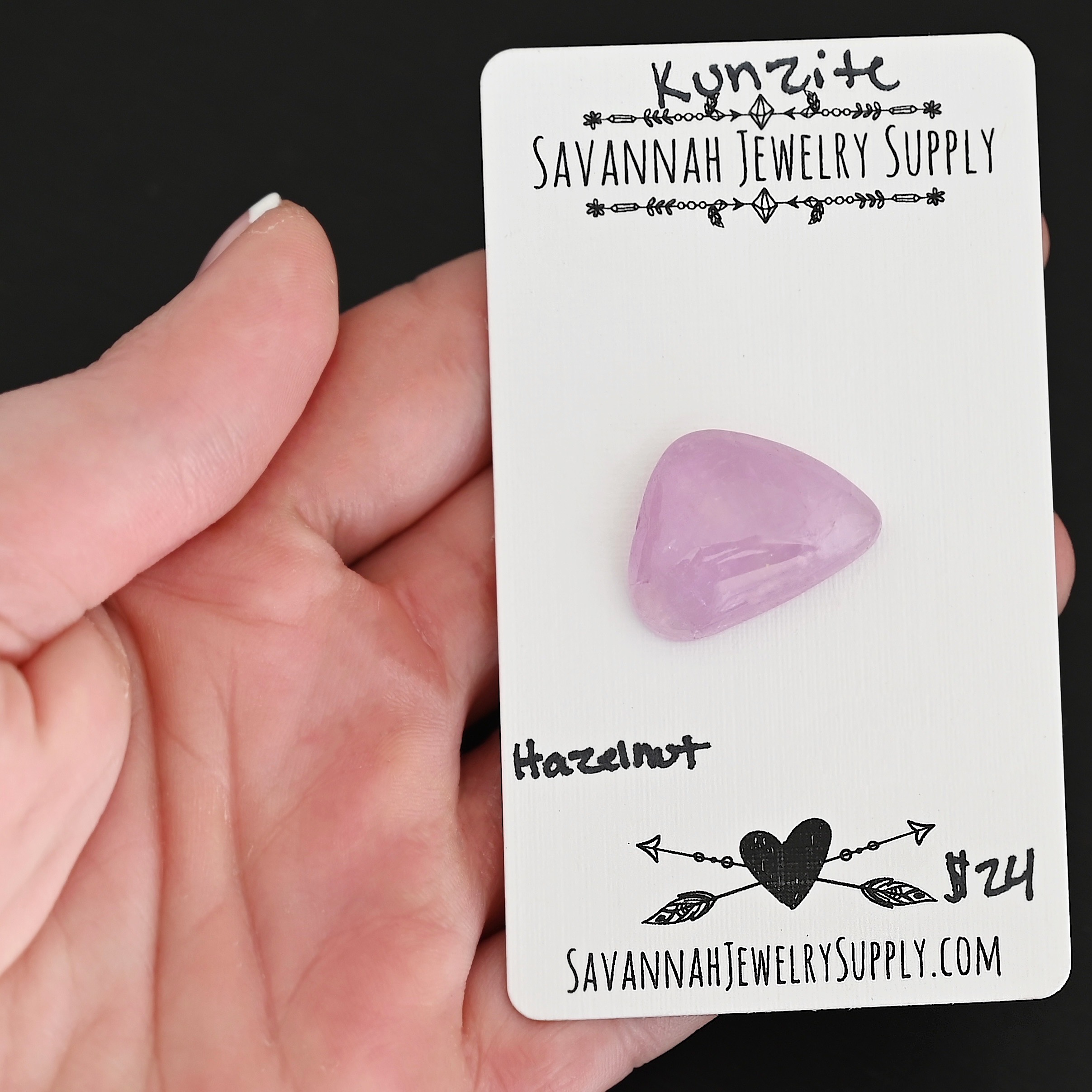 Hazelnut Kunzite Cabochon Parcel shown in hand