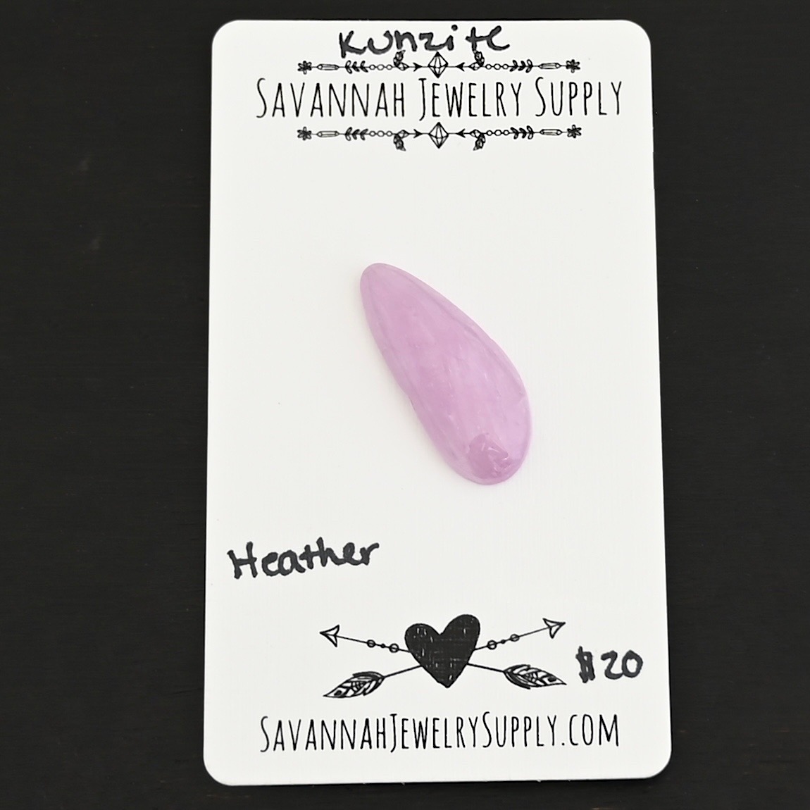 Heather Kunzite Cabochon Parcel shown on business card