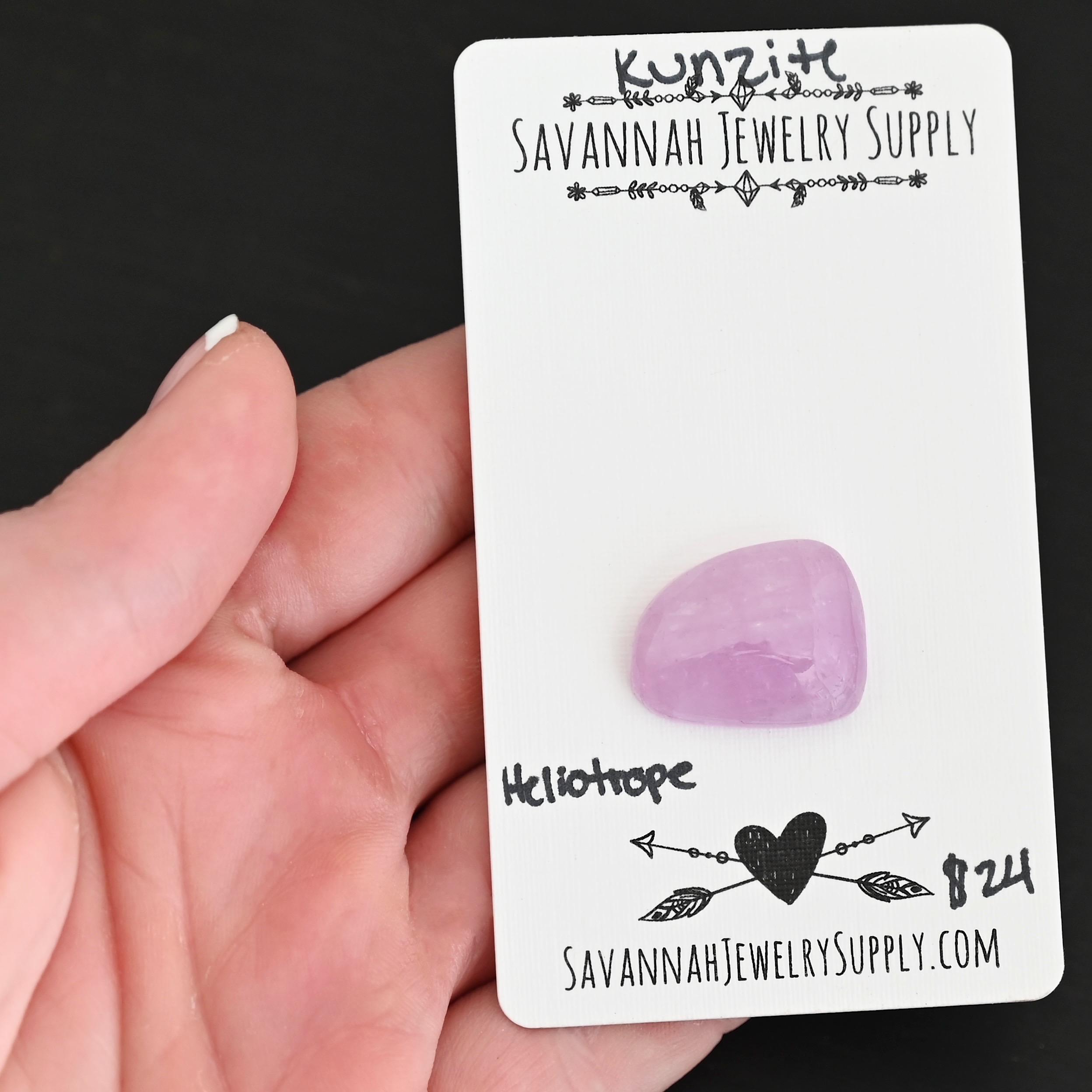 Heliotrope Kunzite Cabochon Parcel shown in hand