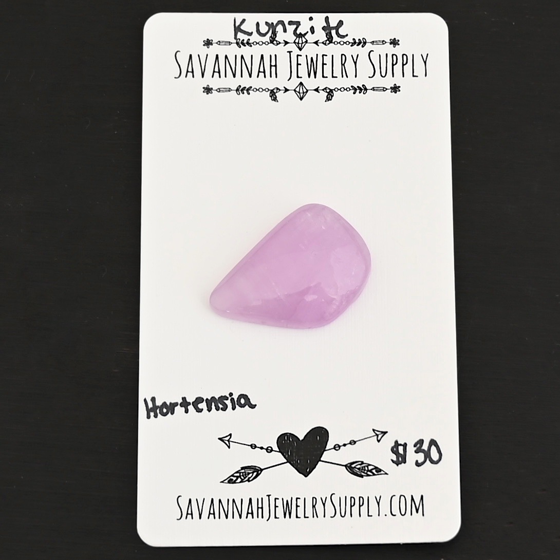 Hortensia Kunzite Cabochon Parcel shown on business card
