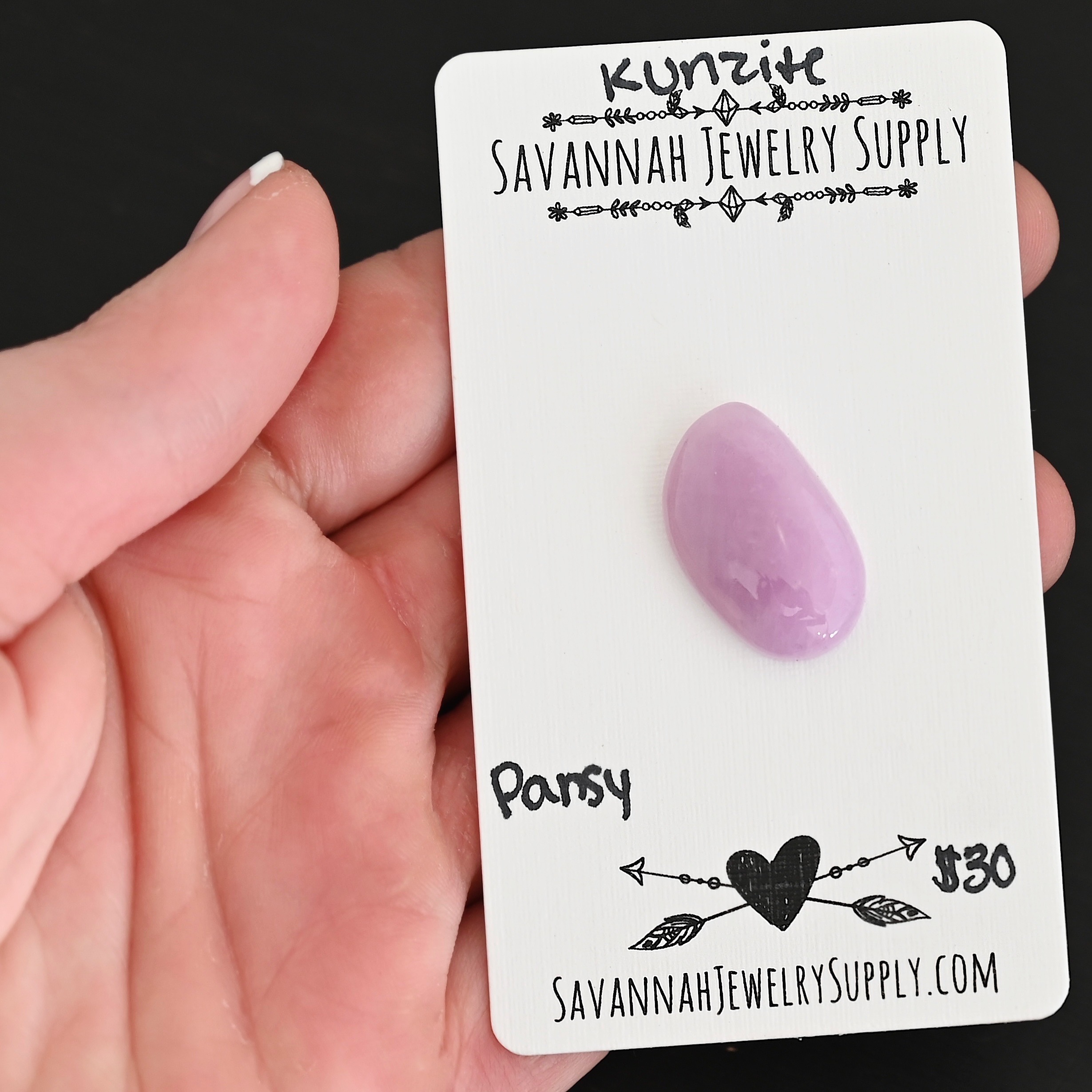 Pansy Kunzite Cabochon Parcel shown in hand