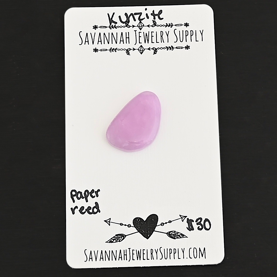 Paper Reed Kunzite Cabochon Parcel shown on business card