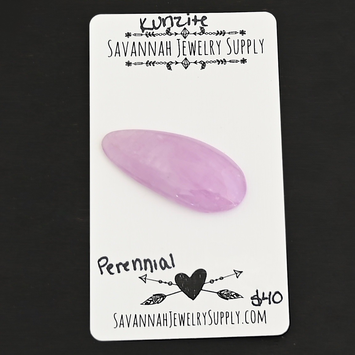 Perennial Kunzite Cabochon Parcel shown on business card