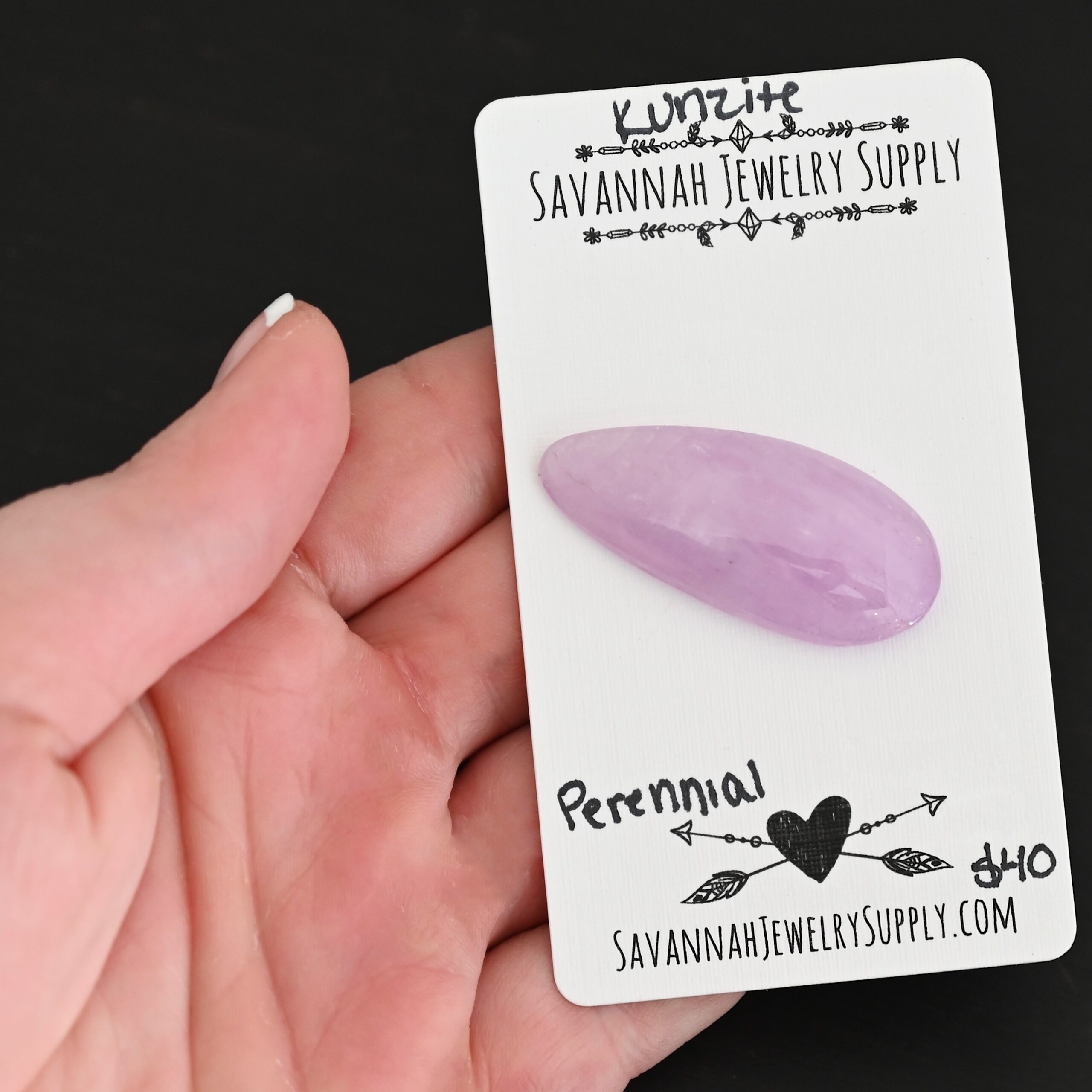 Perennial Kunzite Cabochon Parcel shown in hand