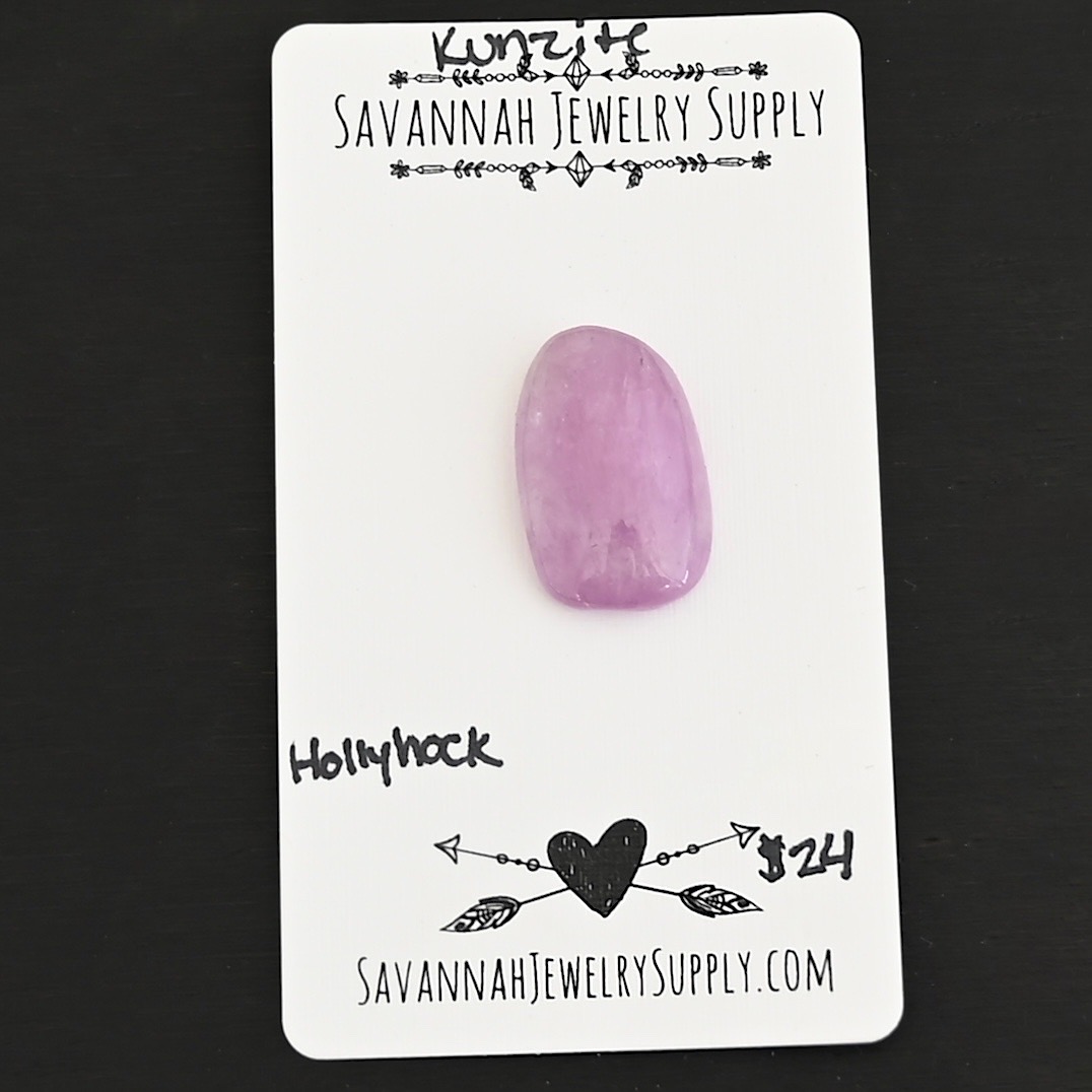 Hollyhock Kunzite Cabochon Parcel shown on business card