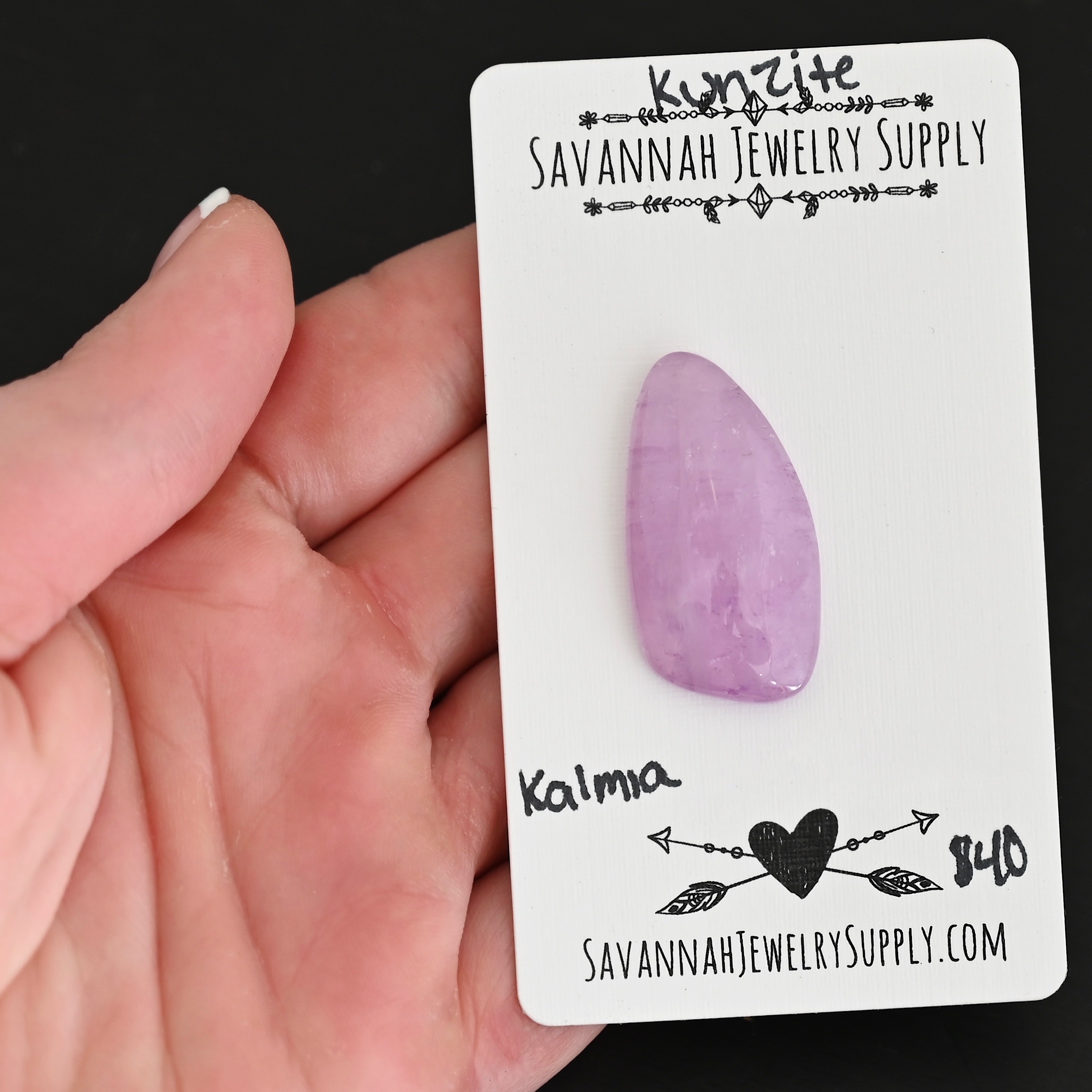 Kalmia Kunzite Cabochon Parcel shown in hand
