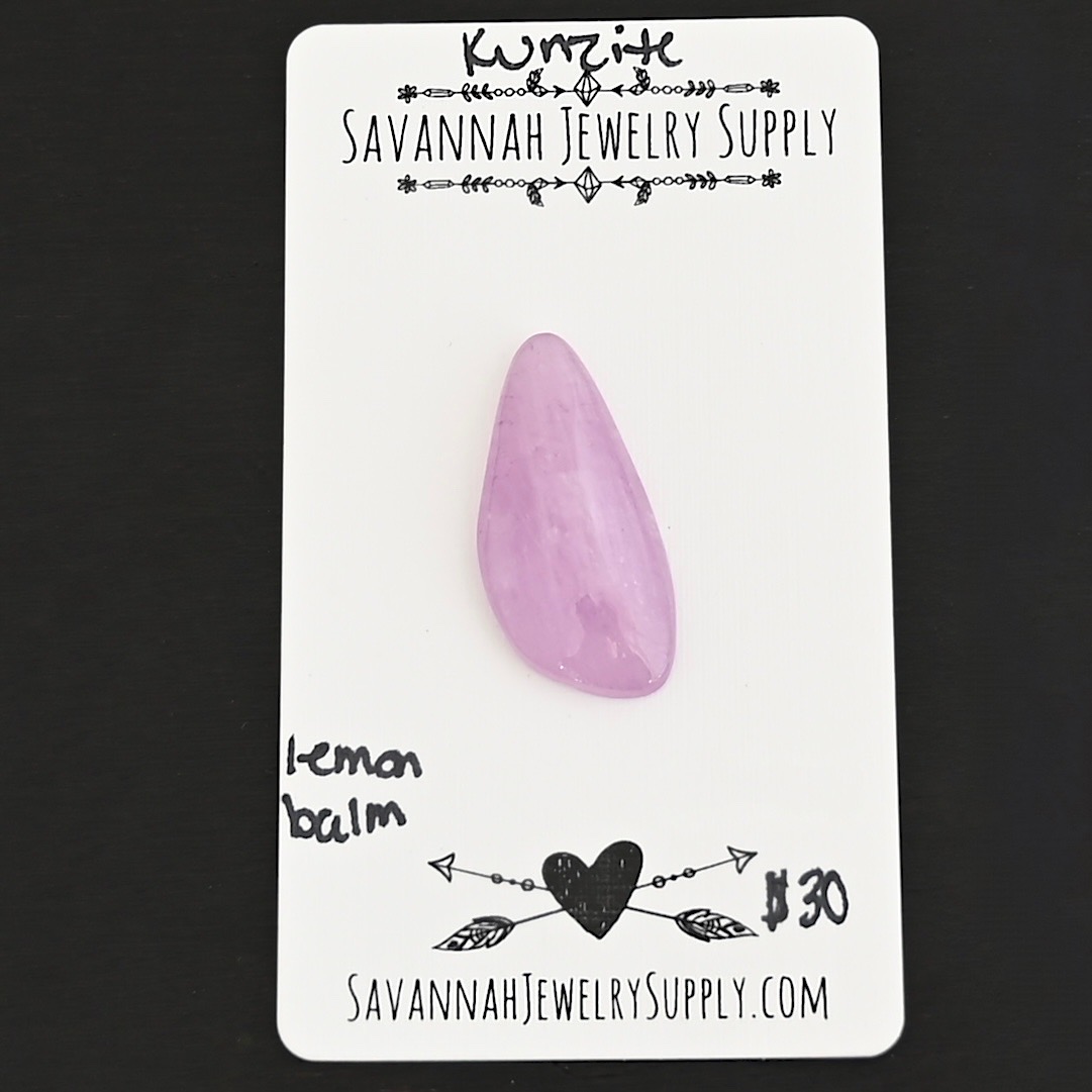 Lemon Balm Kunzite Cabochon Parcel shown on business card
