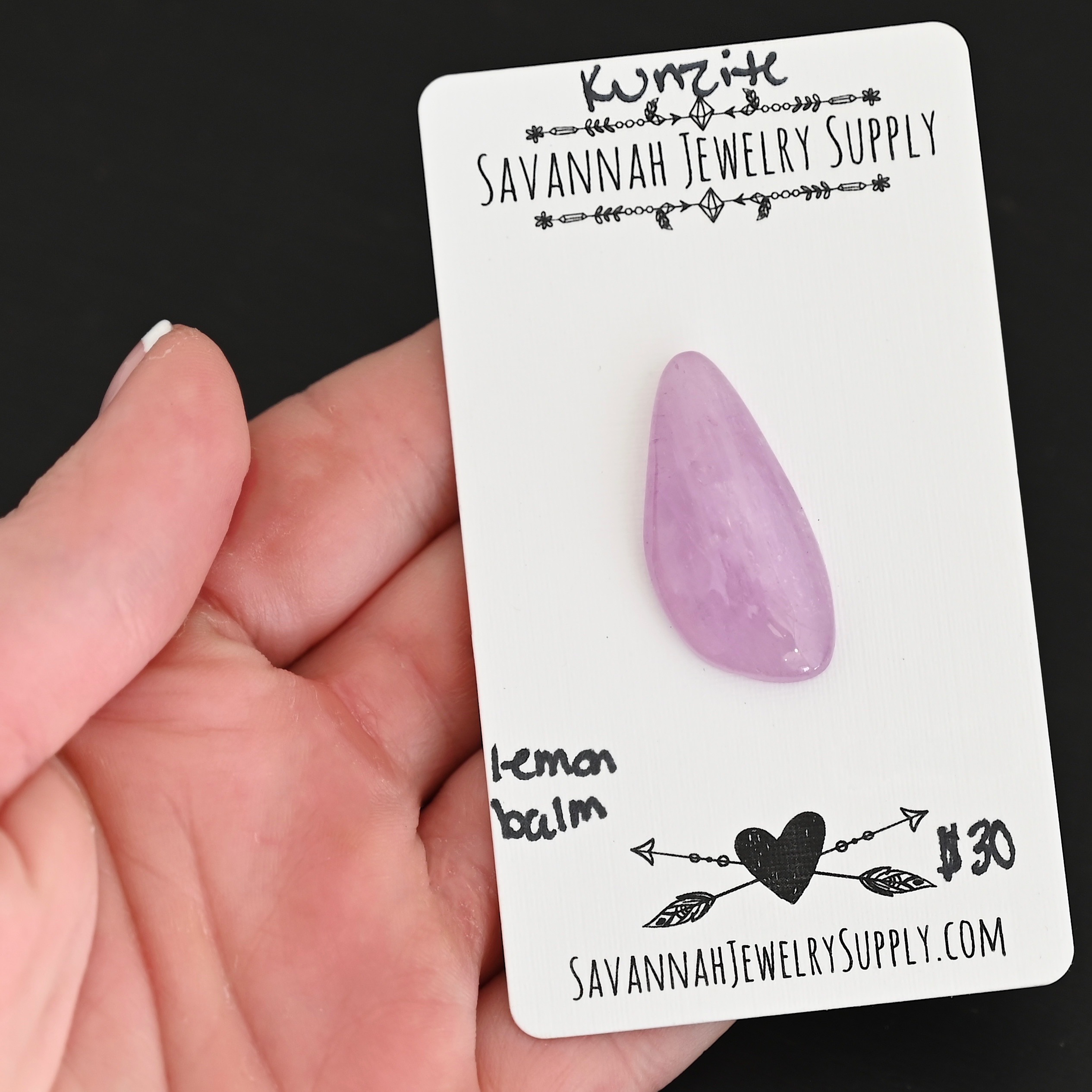 Lemon Balm Kunzite Cabochon Parcel shown in hand