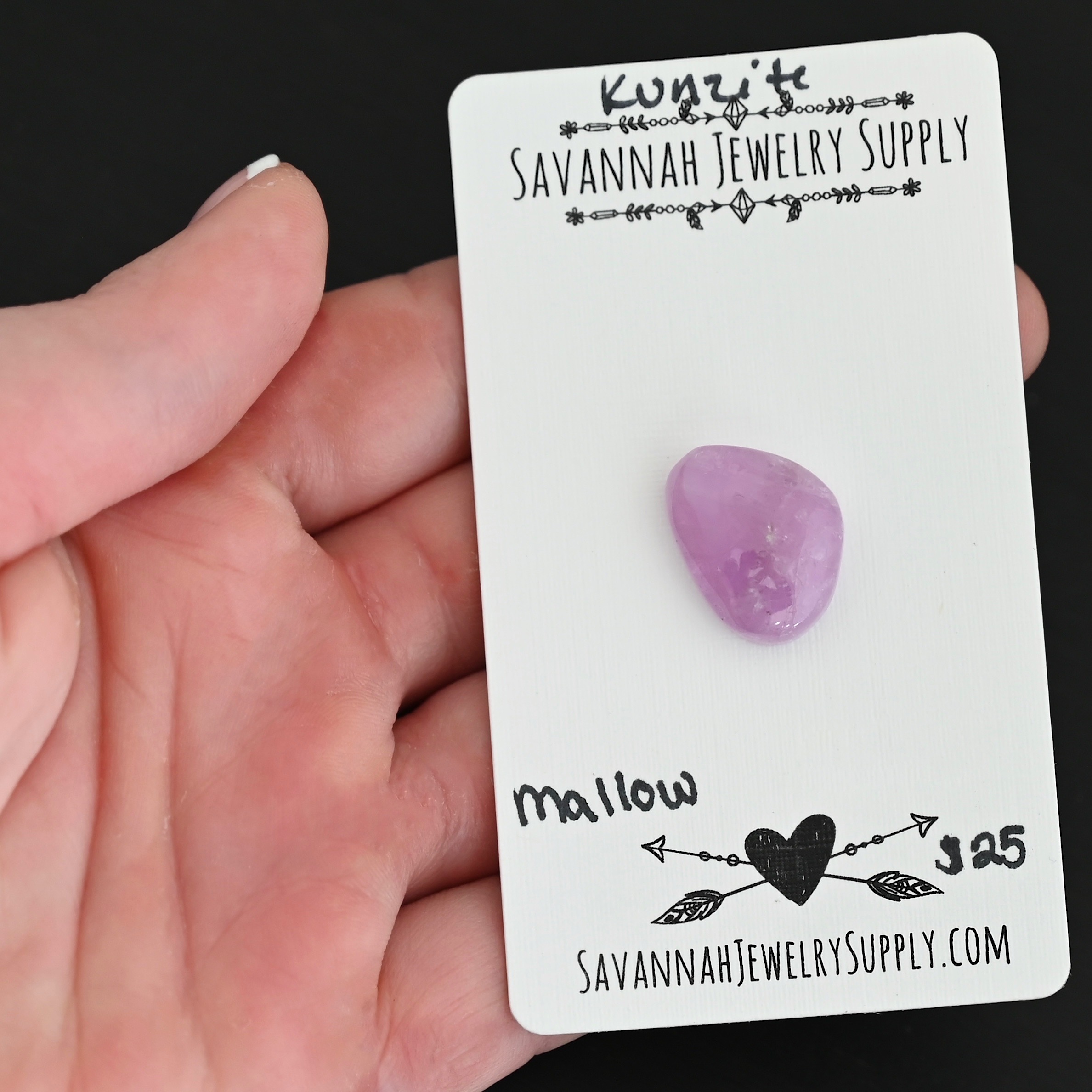 Mallow Kunzite Cabochon Parcel shown in hand