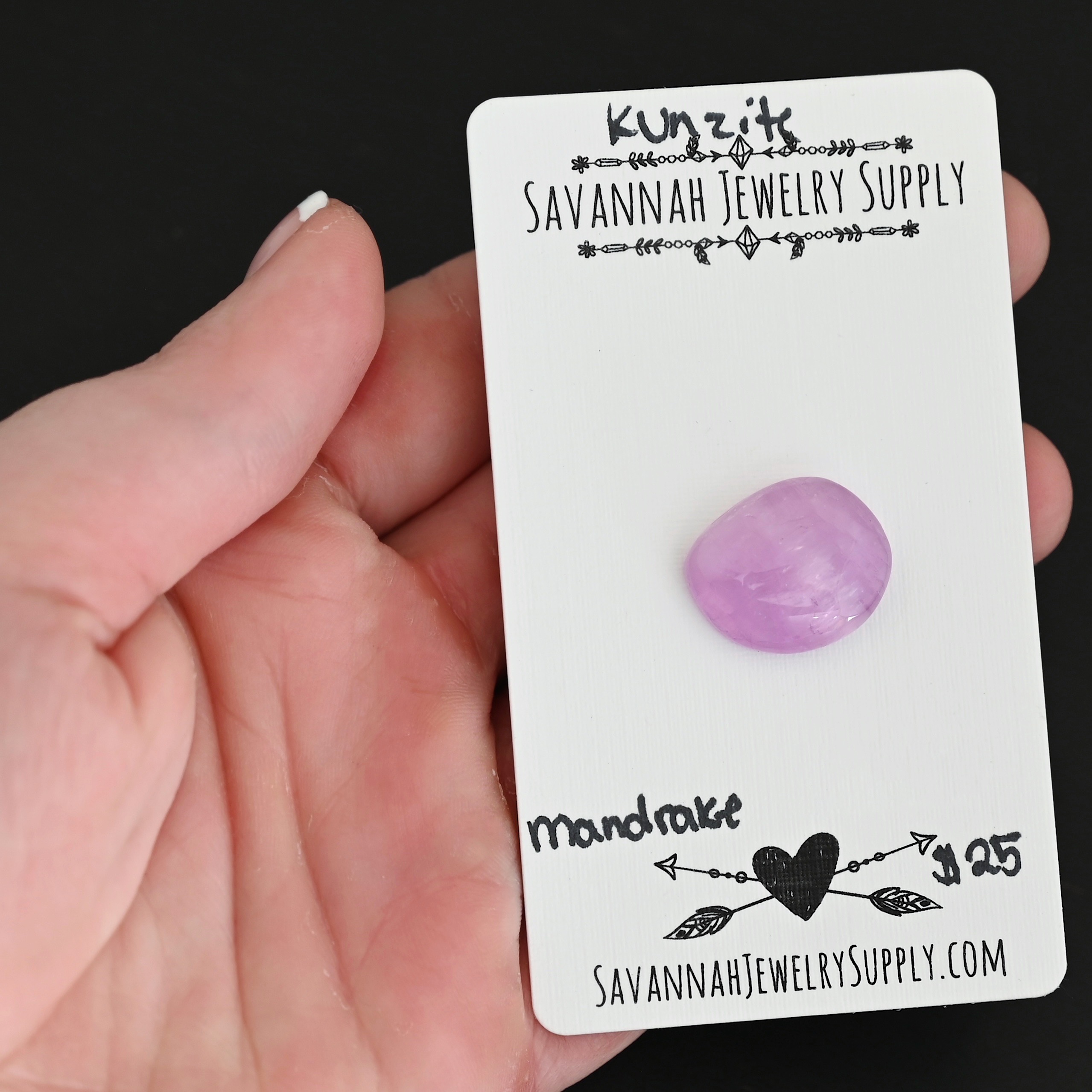 Mandrake Kunzite Cabochon Parcel shown in hand