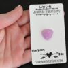 Marjoram Kunzite Cabochon Parcel shown in hand