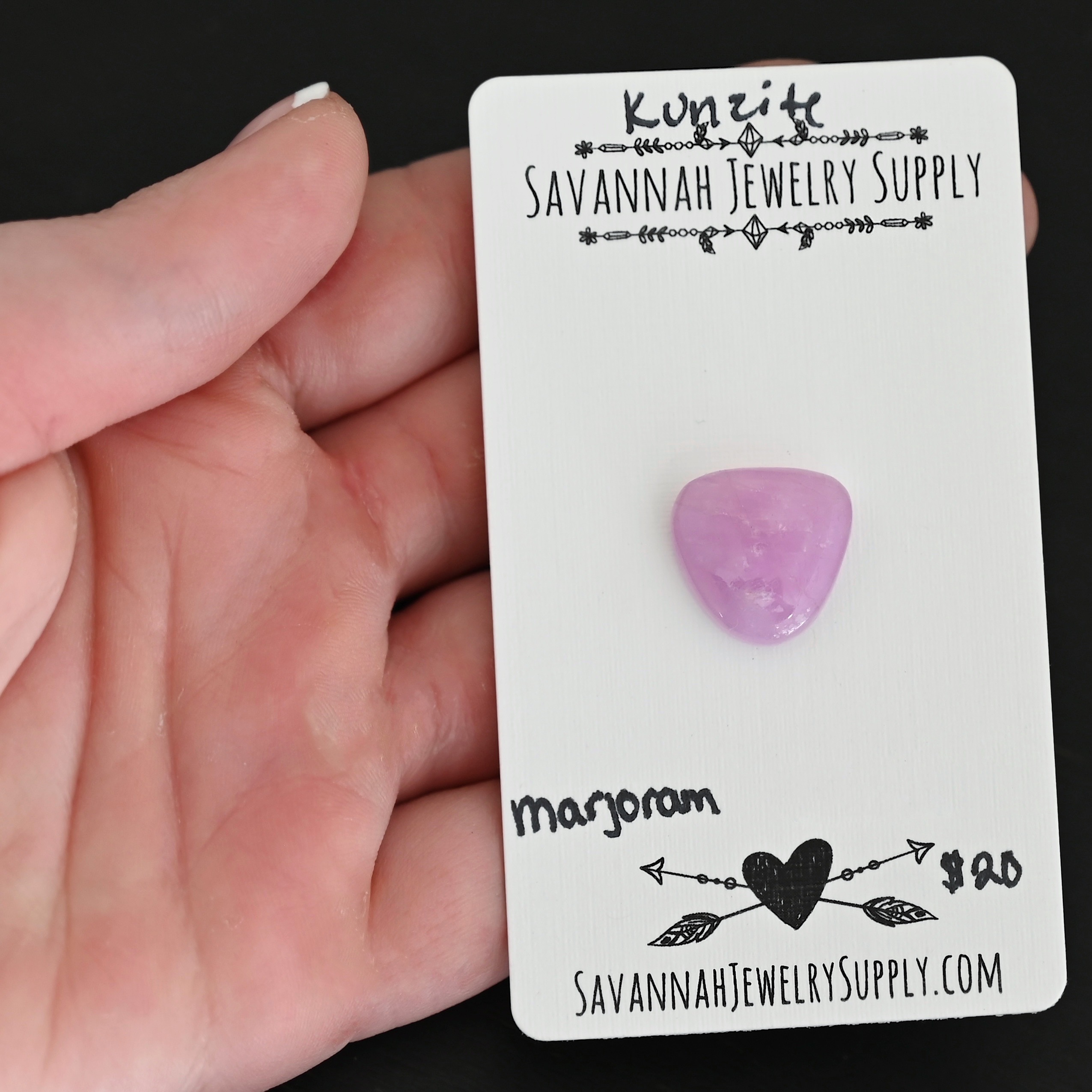 Marjoram Kunzite Cabochon Parcel shown in hand