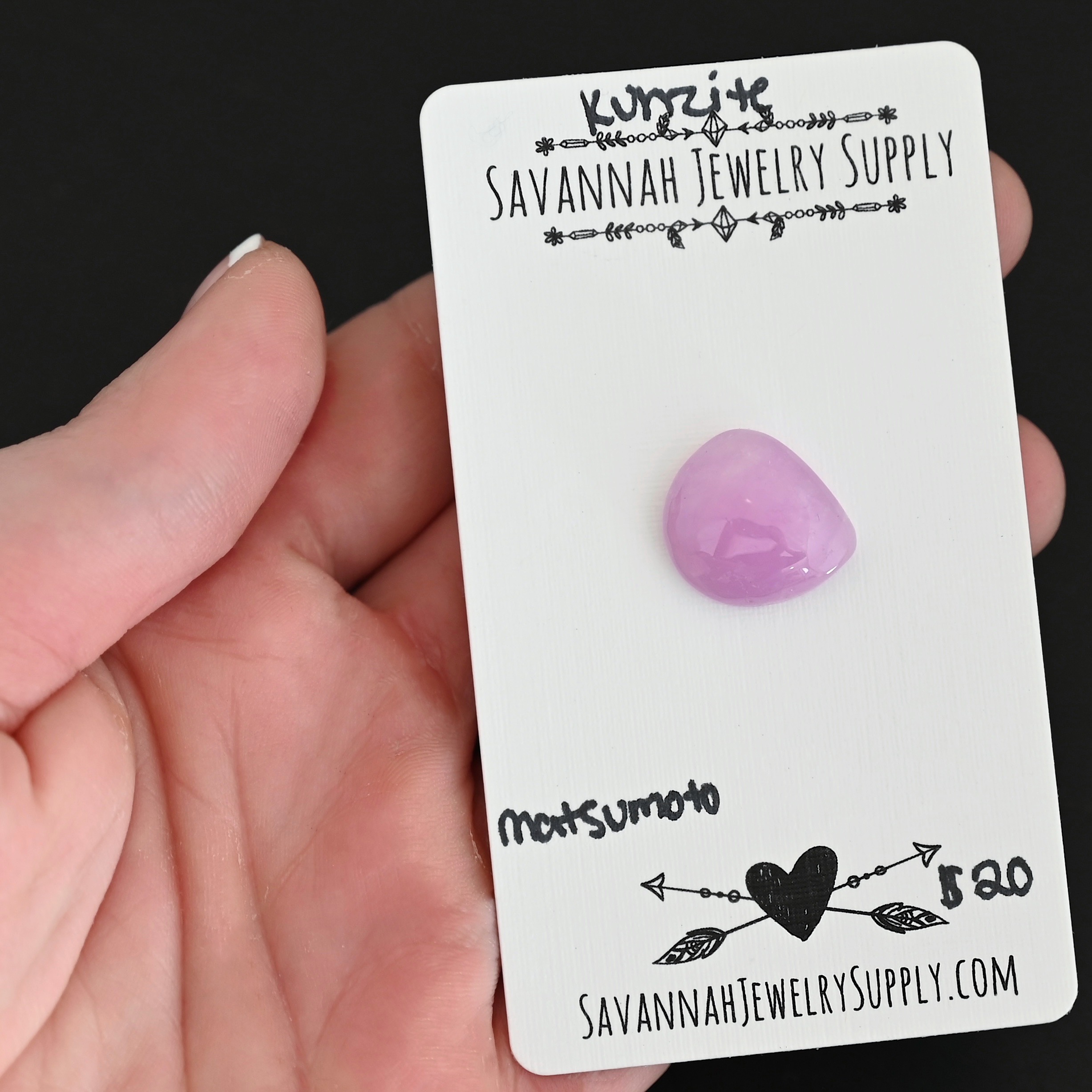 Matsumoto Kunzite Cabochon Parcel shown in hand