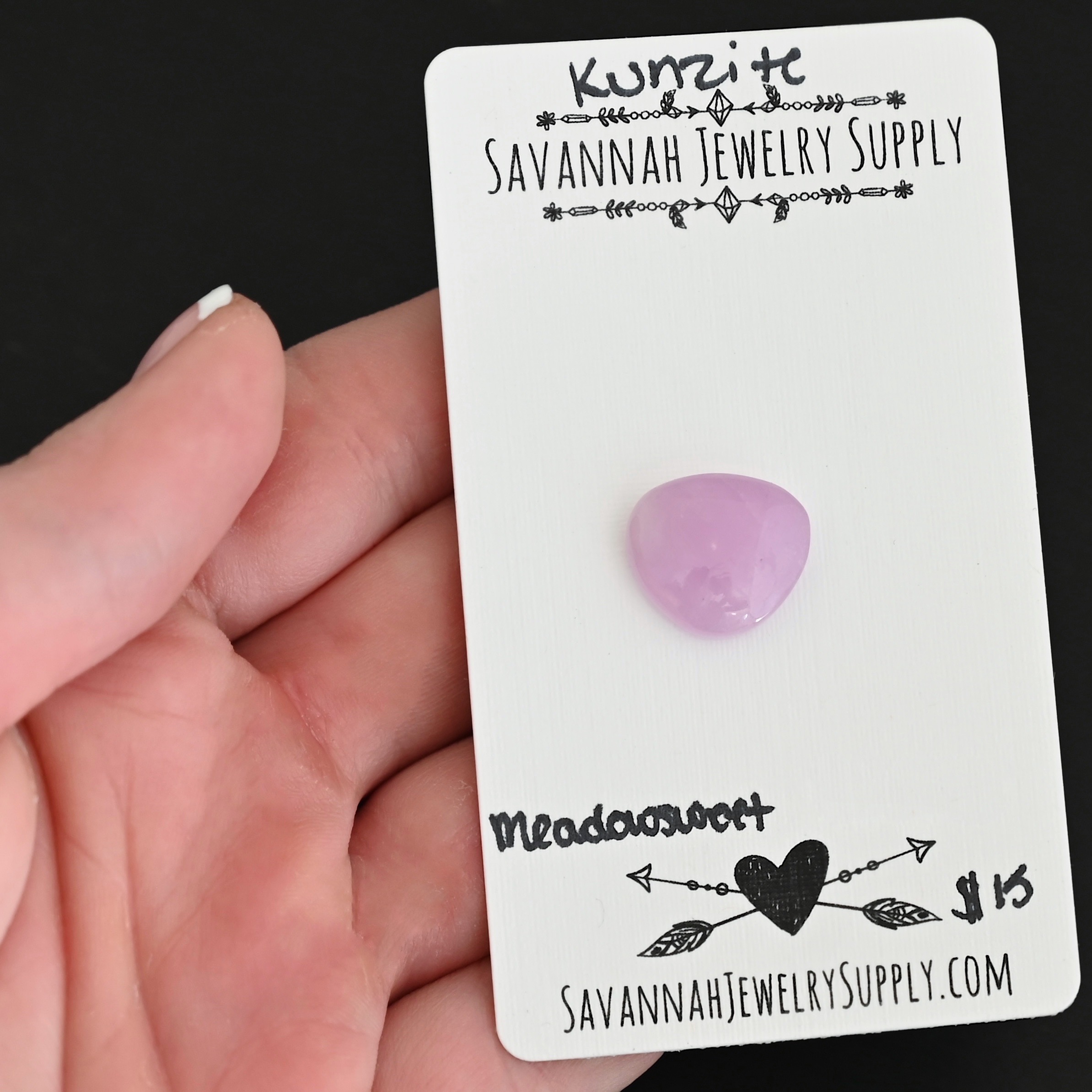 Meadowsweet Kunzite Cabochon Parcel shown in hand