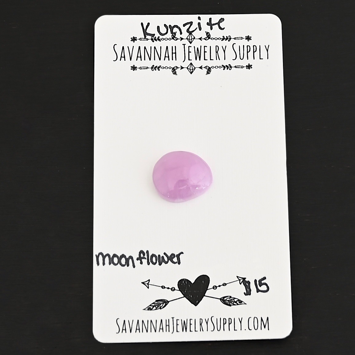 Moonflower Kunzite Cabochon Parcel shown on business card