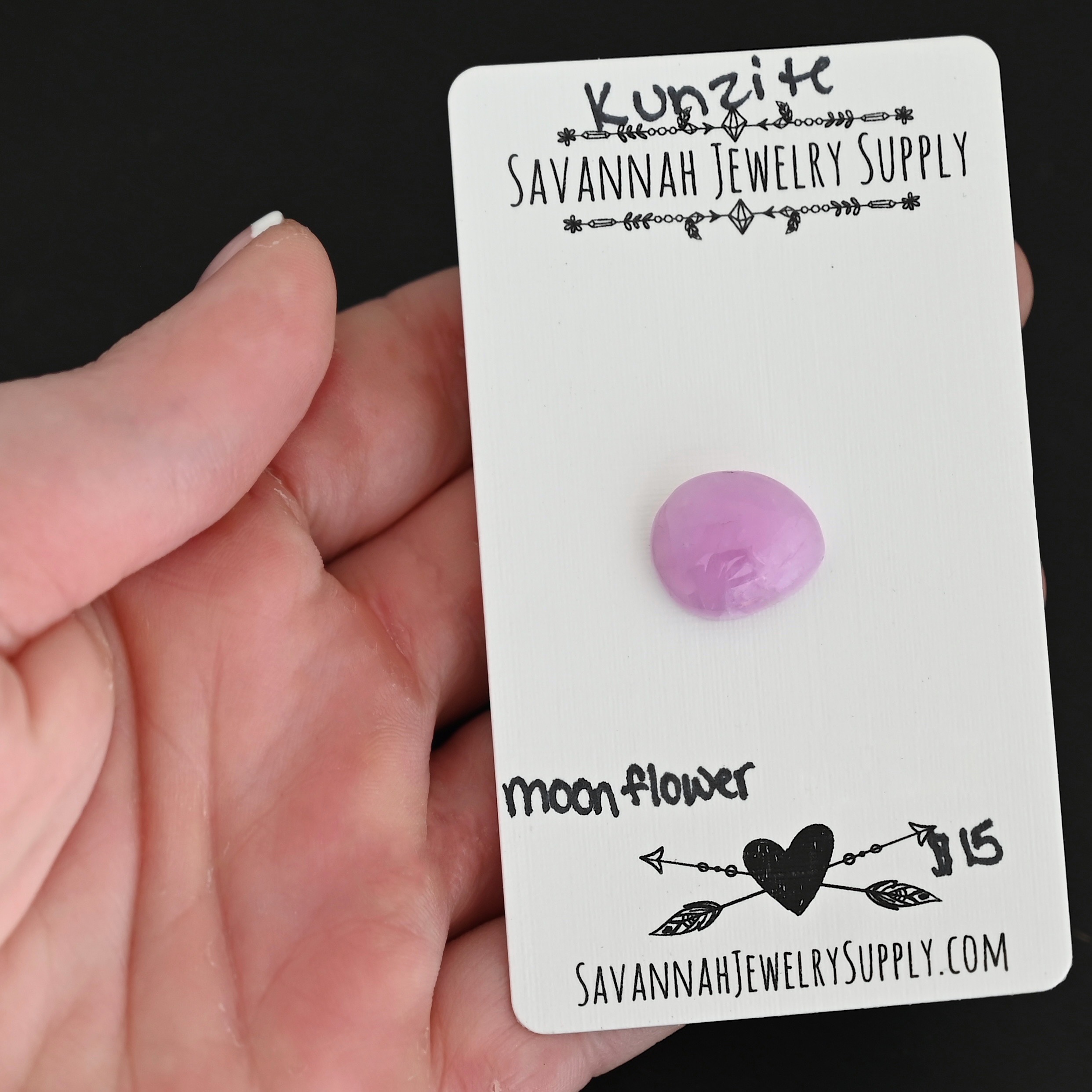 Moonflower Kunzite Cabochon Parcel shown in hand