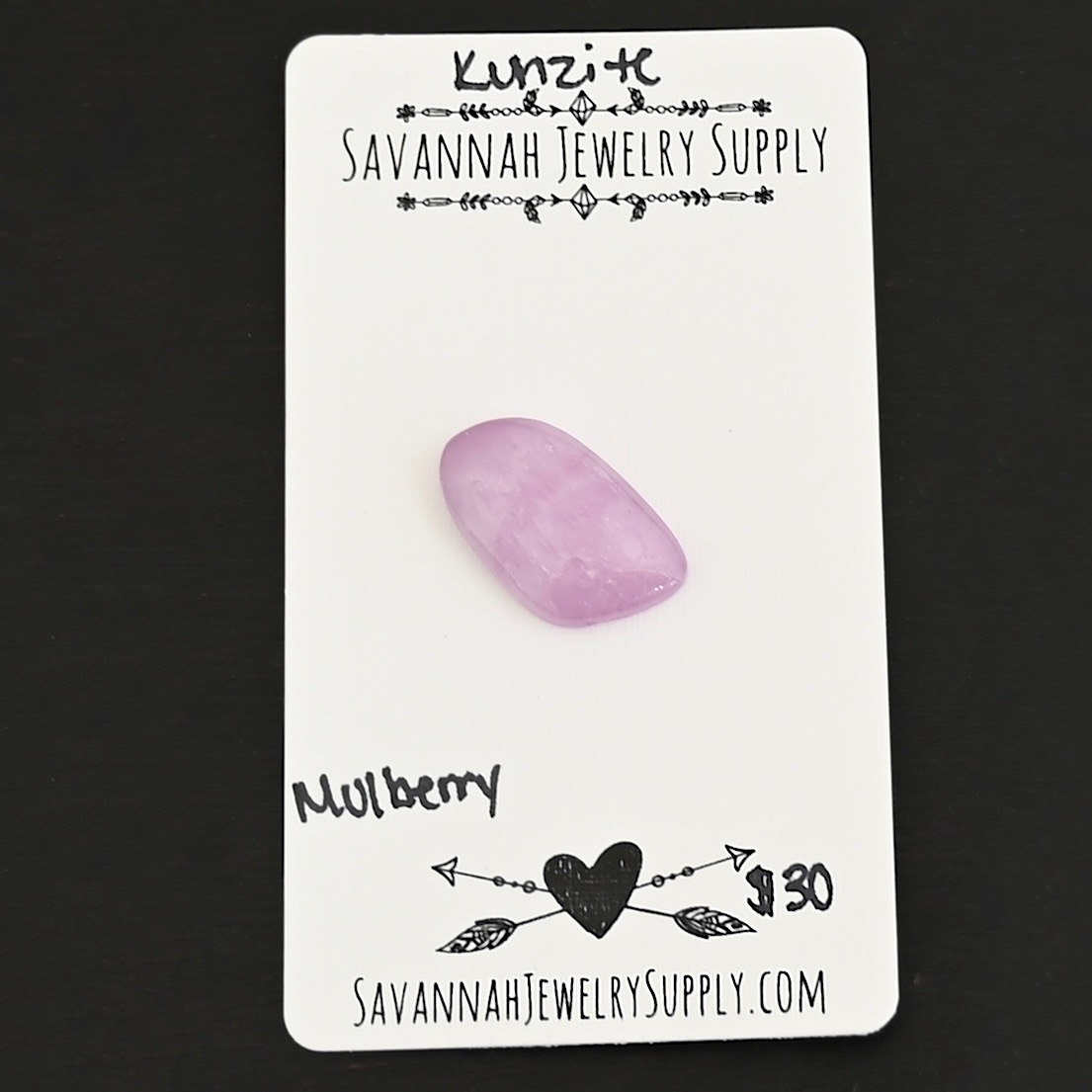 Mulberry Kunzite Cabochon Parcel shown on business card