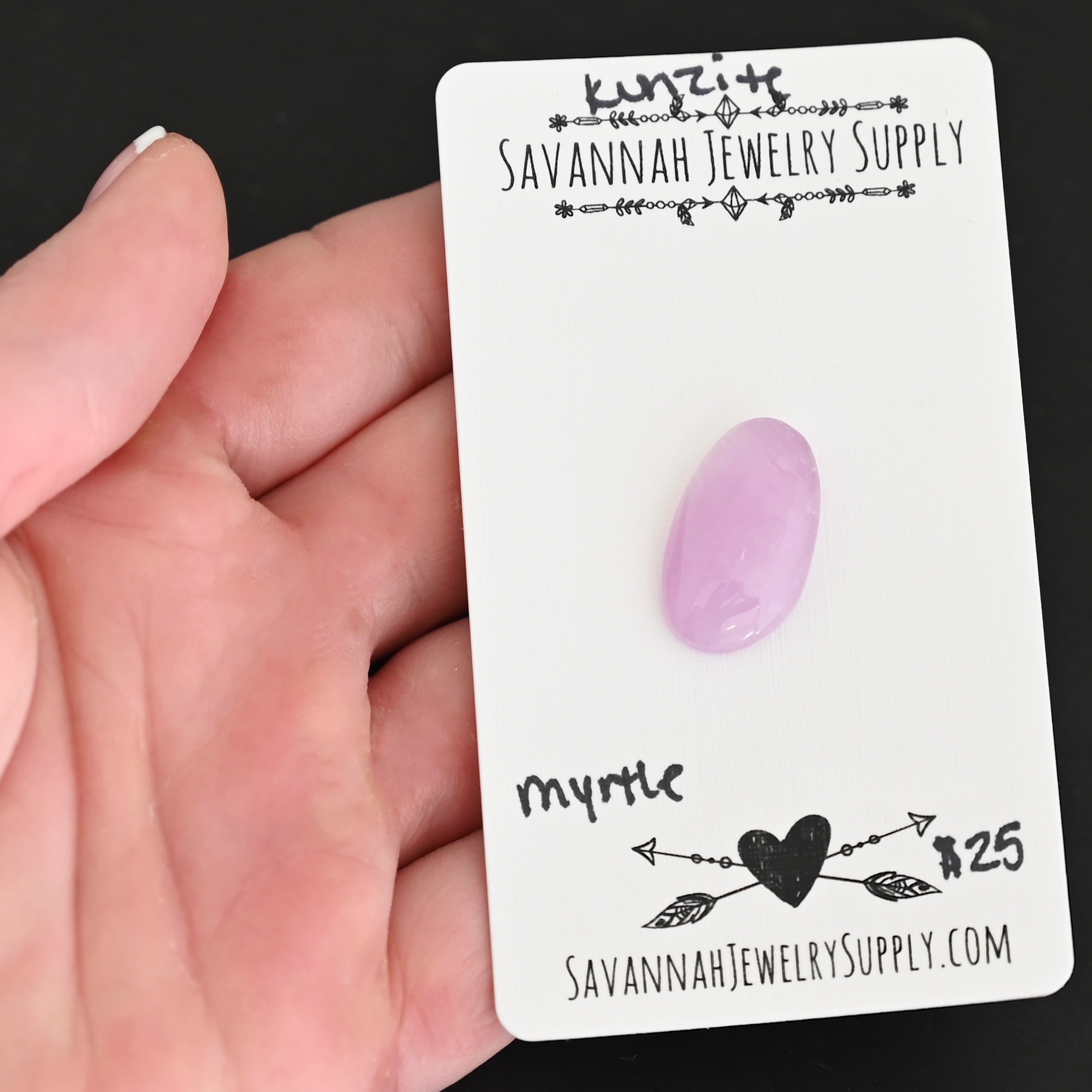 Myrtle Kunzite Cabochon Parcel shown in hand
