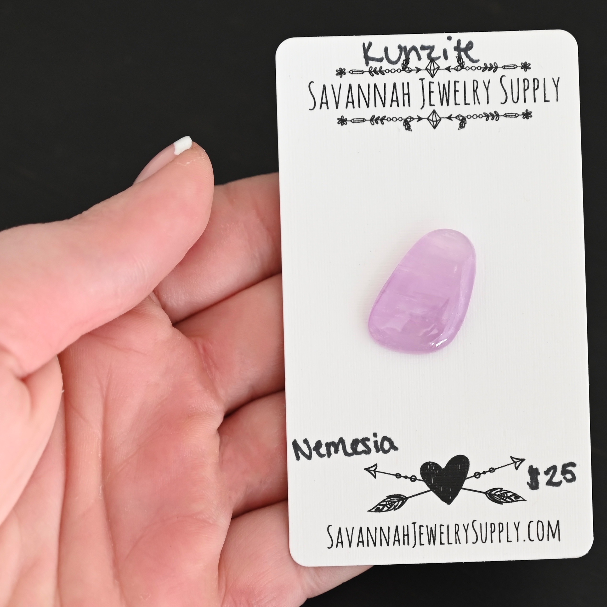 Nemesia Kunzite Cabochon Parcel shown in hand