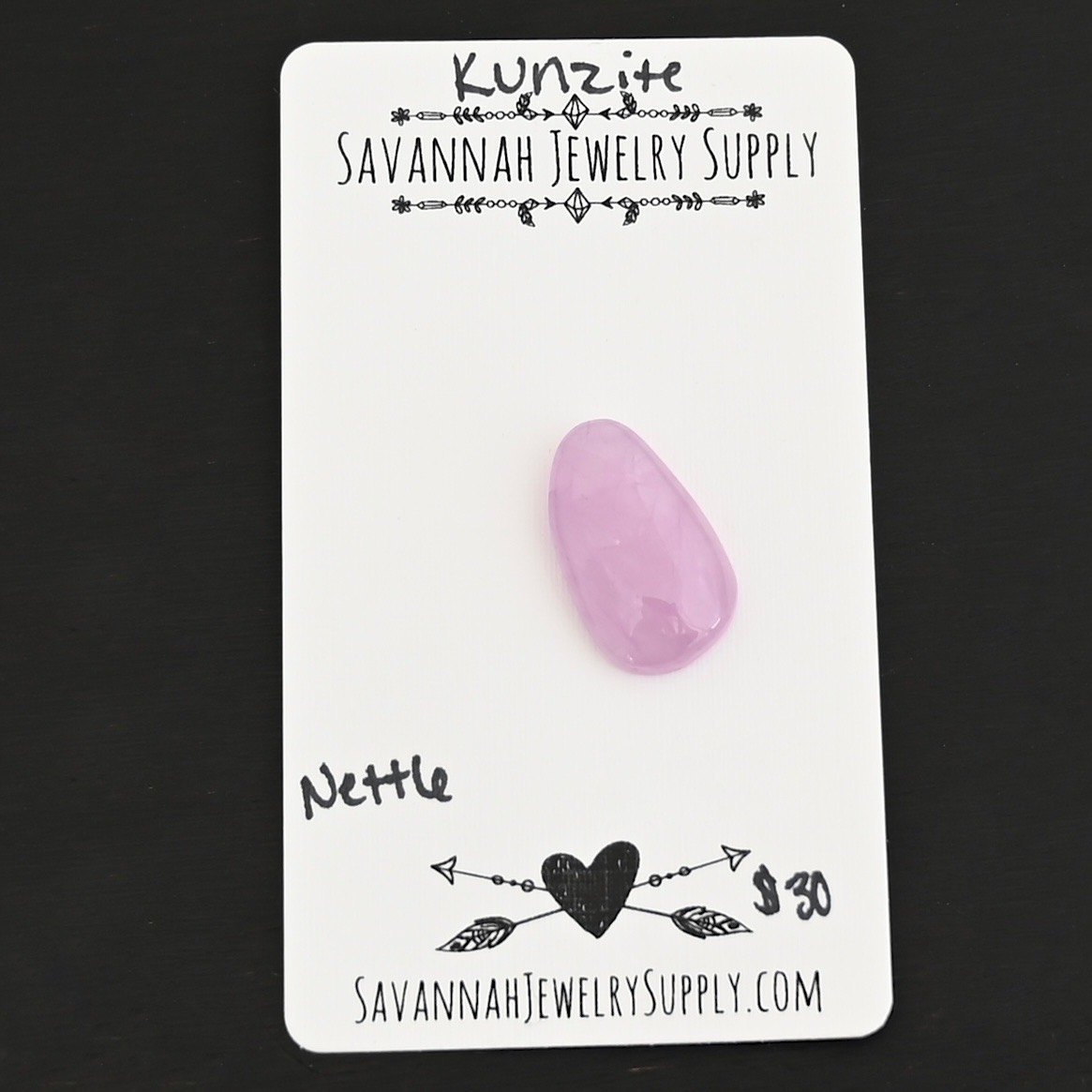 Nettle Kunzite Cabochon Parcel shown on business card