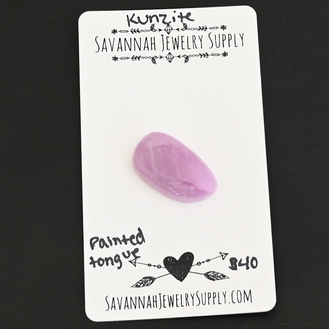 Painted Tongue Kunzite Cabochon Parcel shown on business card