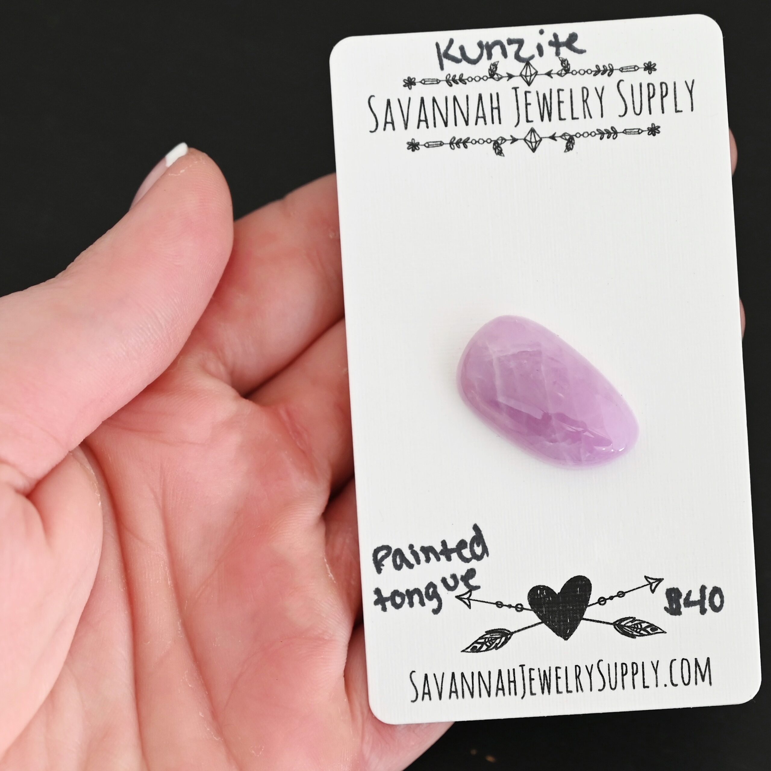Painted Tongue Kunzite Cabochon Parcel shown in hand