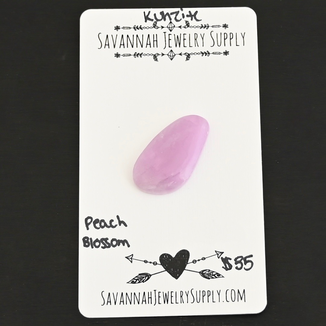 Peach Blossom Kunzite Cabochon Parcel shown on business card