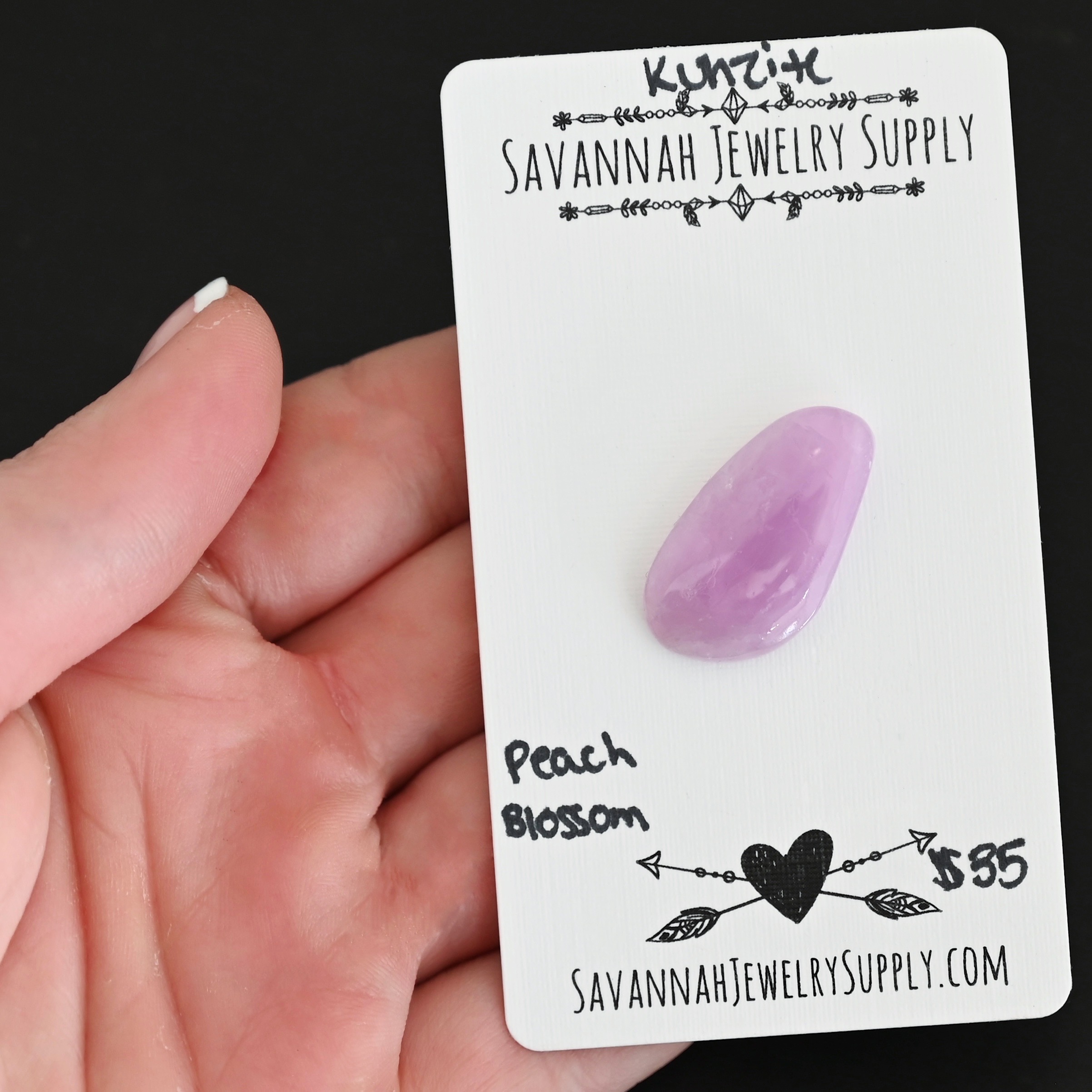 Peach Blossom Kunzite Cabochon Parcel shown in hand